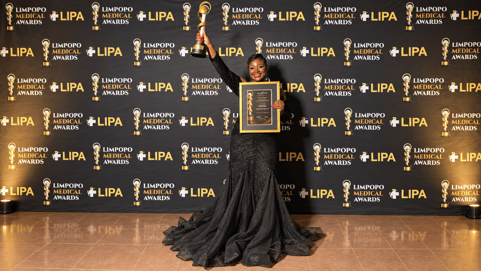 Dr Kholofelo Machaba-Selatole celebrating with the Oral Health Excellence Award trophy and certificate at the Limpopo Medical Awards 2026
